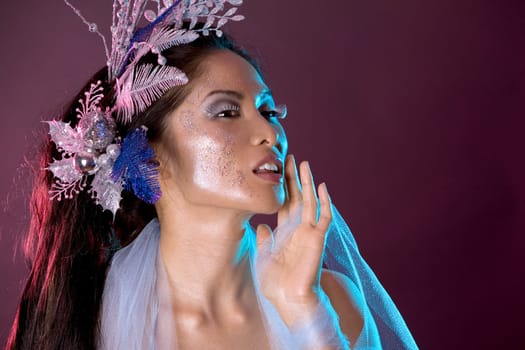 pretty brunette woman wearing white and silver accessories