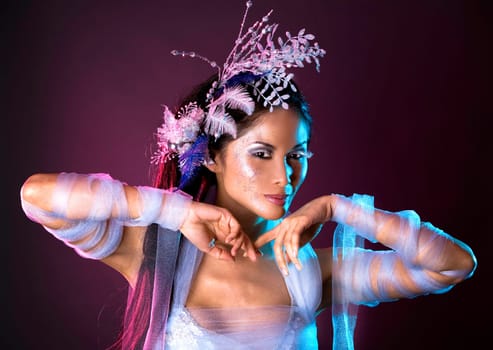 pretty brunette woman wearing white and silver accessories