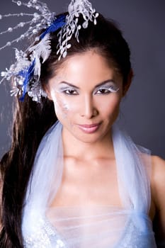 pretty brunette woman wearing white and silver accessories