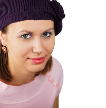 Portrait of a beautiful young woman with a purple hat isolated on white.