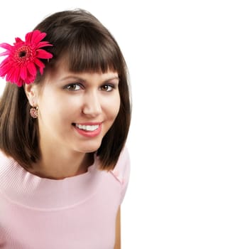 Portrait of a beautiful young woman with a flower in her hair isolated on white.