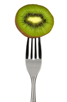 A half of a kiwi pierced on a fork over white background