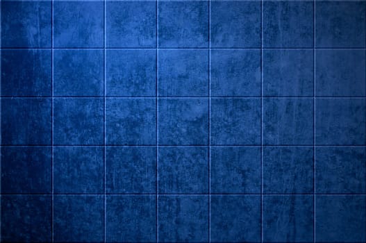 Stone wall with blue tiles