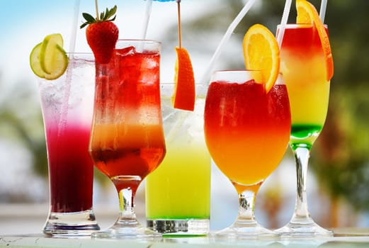 Composition with five glasses of drinks
