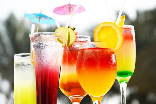 Composition with five glasses of drinks