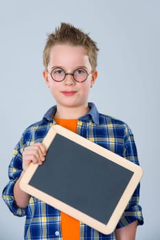 boy with glasses and little blackboard