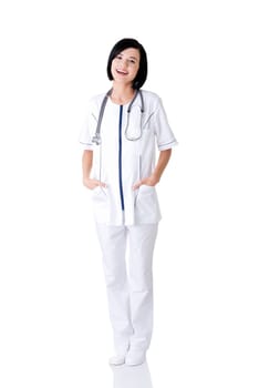 Nurse or young doctor standing smiling. Isolated on white background. Full body