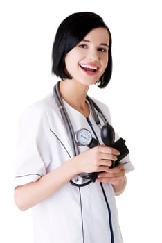 Woman doctor or nurse with blood pressure gauge