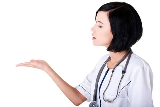 Medical doctor woman or nurse presenting and showing copy space for product or text, isolated on white background