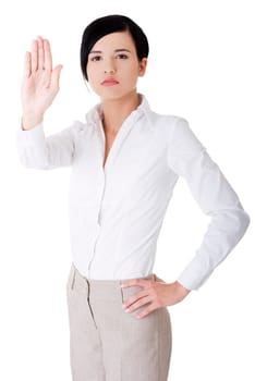 Seriouse businesswoman gesturing stop with her hand