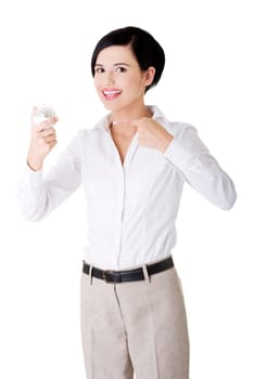 Businesswoman showing led bulb, isolated on white