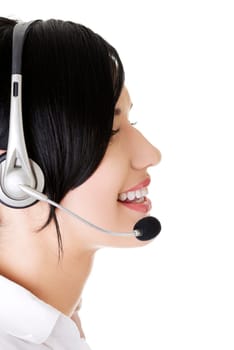 Beautiful young call-center assistant smiling , isolated