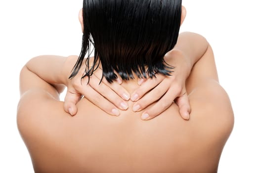 Young woman with pain in her back. Isolated