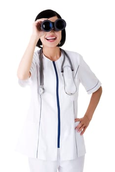 Looking in the futere of health care. Female doctor or nurse looking through binoculars.
