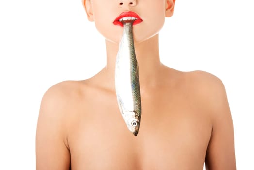 Beautiful young woman with fish in her mouth