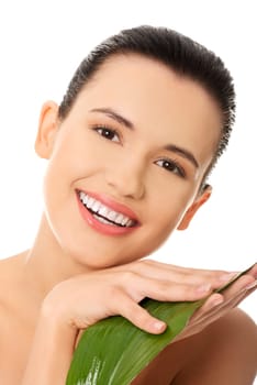 Portrait of young beautiful woman with green leaf , isolated