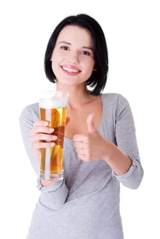 Beautiful and sexy young woman with glass of beer gesturing thumbs up, isolated on white