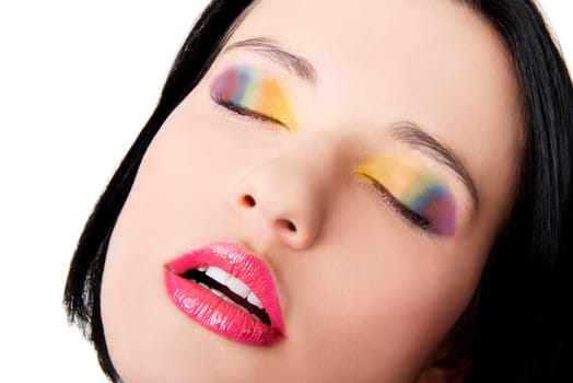 Beautiful woman with rainbow eye make up, isolated on white