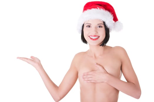 Sexy topless woman with perfect slim body wearing santa hat and showing on copy space.