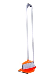 Orange  broom and scoop isolated on white
