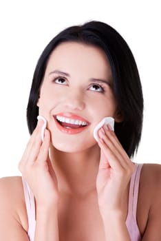 Closeup portrait of beautiful woman with cotton pad
