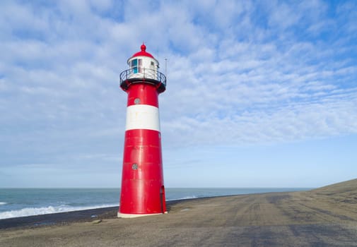 "Noorderhoofd""  lighthouse in Westkapelle, Netherlands. It has 3 colors of light, white (6000 candela), red and green (1800 candela). Together with the main lighthouse in the village it sends a light beacon to the ""Oostgat""."