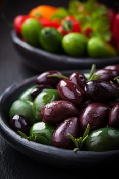 Mixed olives with raw snack vegetable as antipasti