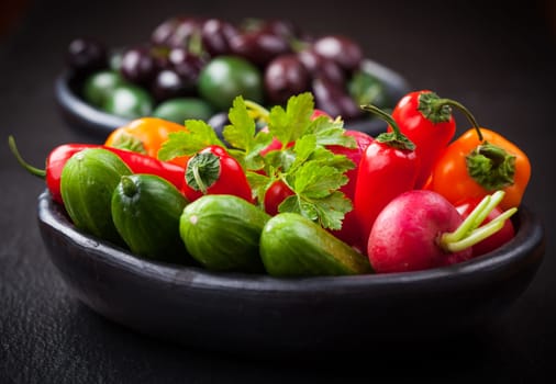 Raw snack vegetable with olives as antipasti