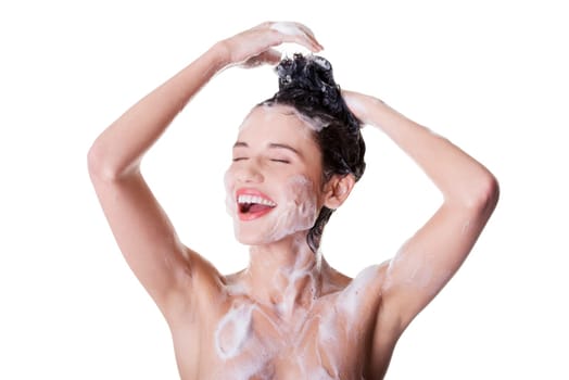 Young fit beautiful woman in shower washing her perfect fit body