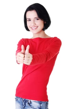 Beautiful young woman in casual clothes gesturing thumbs up.