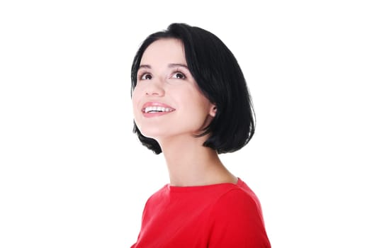 Shocked and excited woman looking up, isolated on white