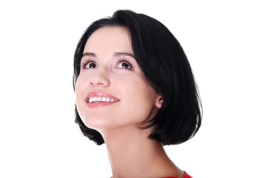 Portrait of a happy young woman looking up - isolated on white