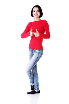 Beautiful young woman in casual clothes gesturing thumbs up.