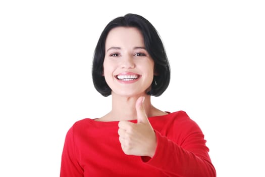 Beautiful young woman in casual clothes gesturing thumbs up.