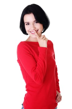 Happy woman making a keep it quiet gesture , isolated on white