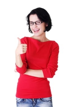 Beautiful young woman in casual clothes gesturing thumbs up.