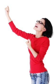 Excited happy young woman with fists up, isolated