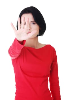 Confident woman making stop gesture sing with hand