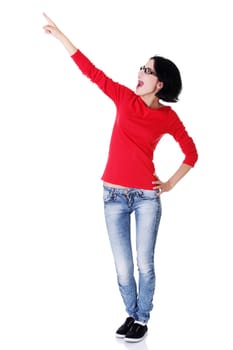 Happy , excited young woman pointing on copy space, isolated on white