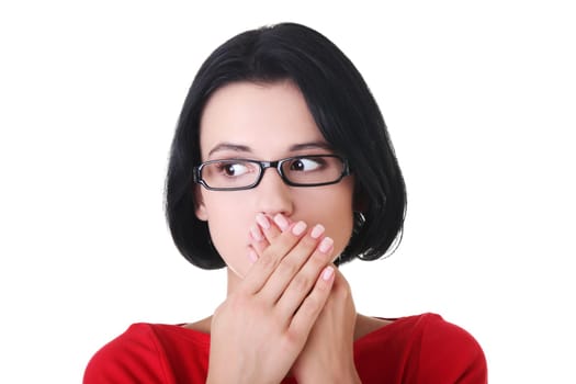 Shocked woman covering her mouth with hands, isolated on white