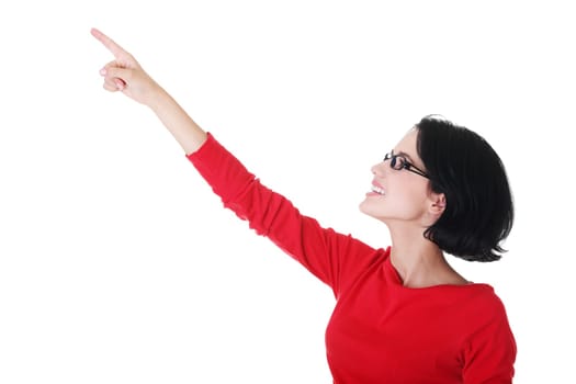Happy , excited young woman pointing on copy space, isolated on white