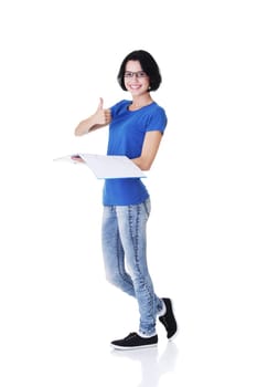 Isolated full length portrait of a beautiful young woman student.