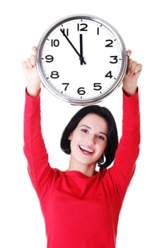 Happy young woman holding office clock, isolated on white background