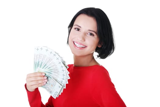 Cheerful young lady holding cash - polish zloty ( pln )