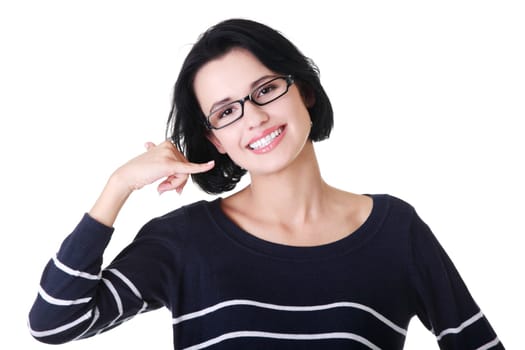 Young happy woman gesturing "call me"""
