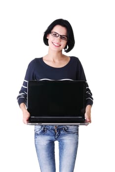 Young woman holding and showing screen of 17 inch laptop