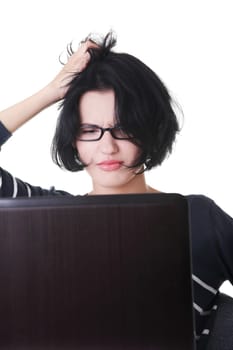 Frustrated woman working on laptop, isolated on white