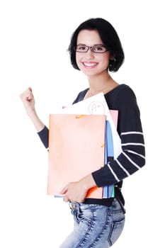 Happy student woman with notebooks showing win gesture with fist, isoalted on white background