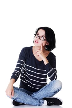 Young beautiful woman in casual clothes thinking, isolated on white