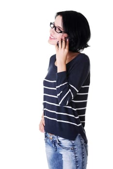 Young happy caucasian woman is calling with a mobile phone (smartphone) isolated on white